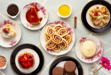 variety of baked and dessert foods on plates