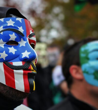 close up photo of person wearing guy fawkes mask