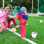 toddler playing soccer