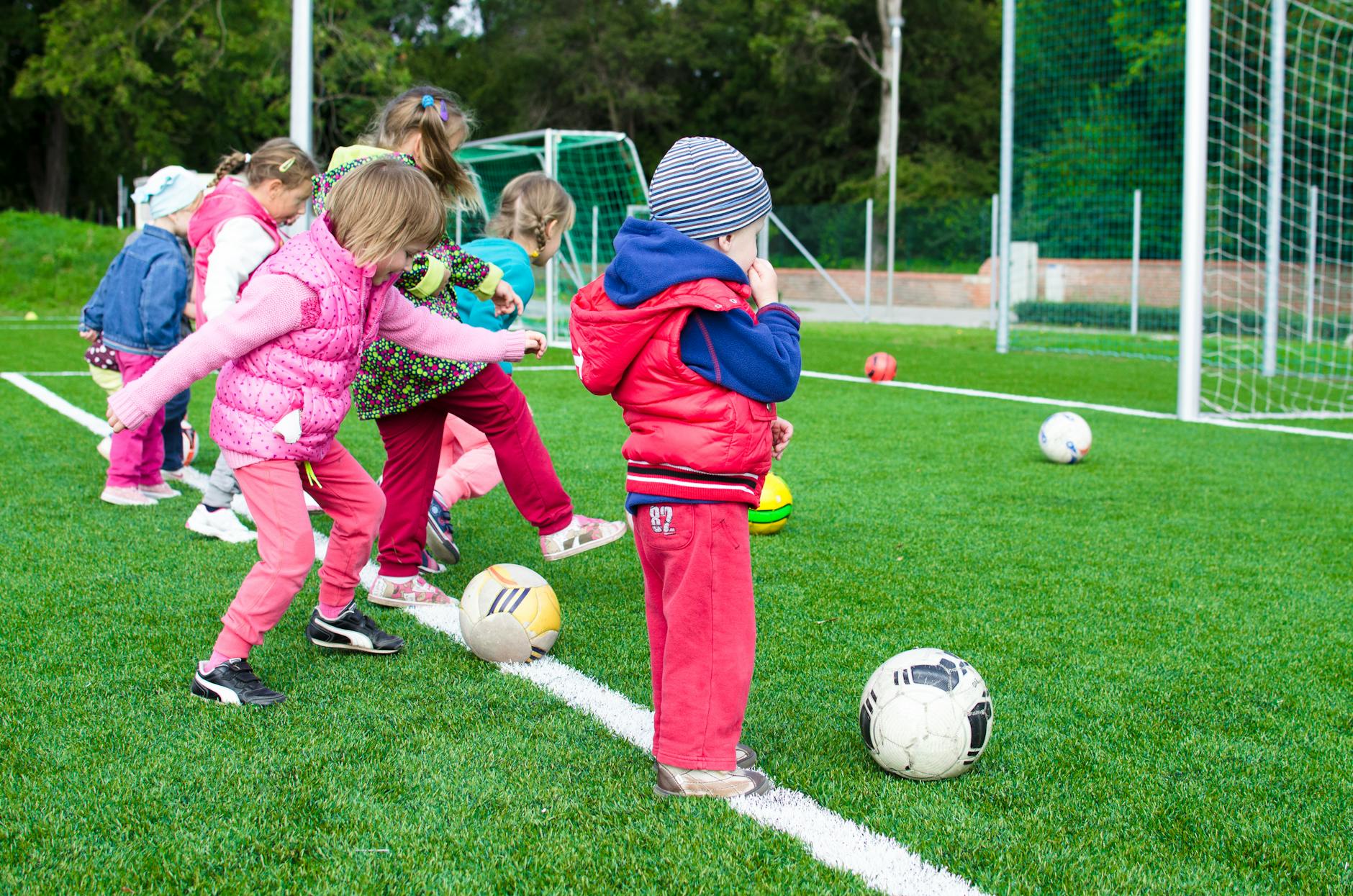 toddler playing soccer