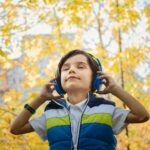 photo of a boy listening in headphones