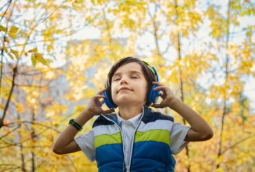 photo of a boy listening in headphones