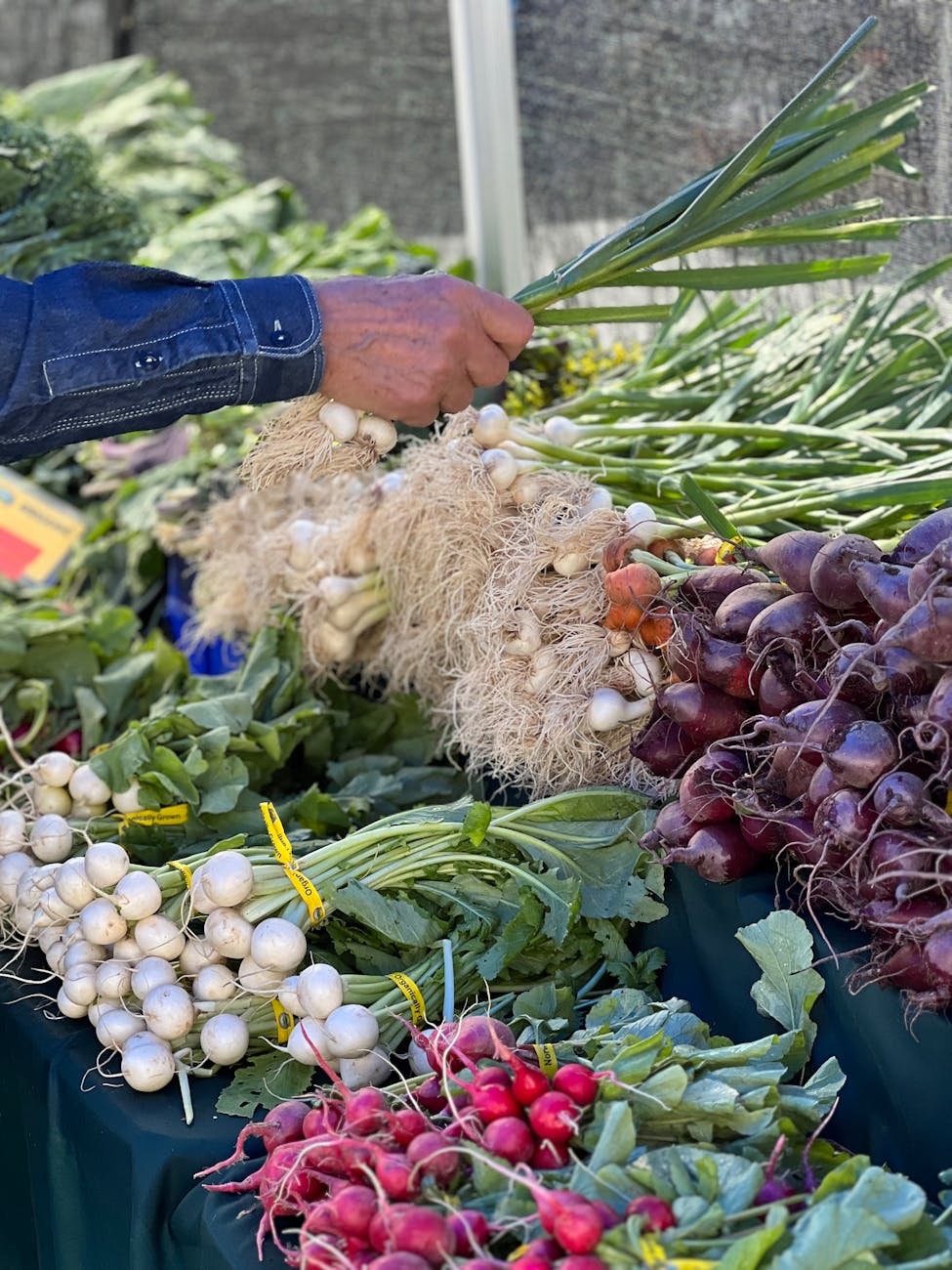 man buying vegetables at food market