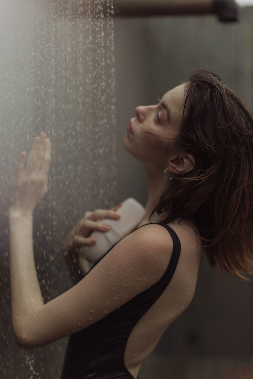 close up photo of woman taking a shower