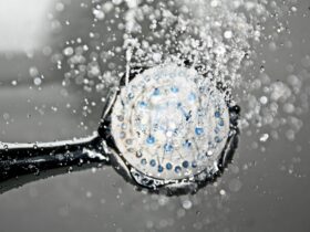 black shower head switched on