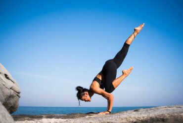 low angle view of woman relaxing on beach against blue sky