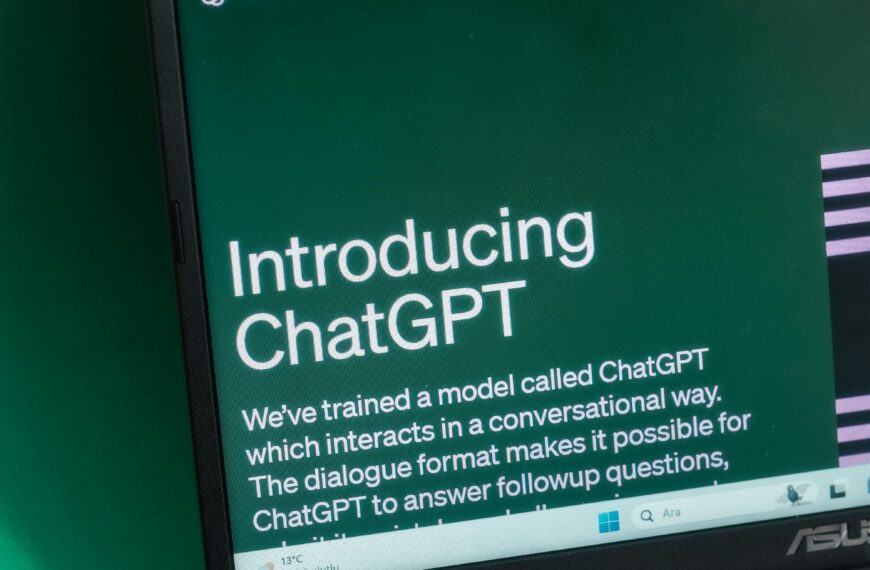 Laptop screen displaying the introductory page of ChatGPT on OpenAI's website.