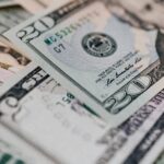 Closeup of diverse dollar banknotes randomly placed on surface