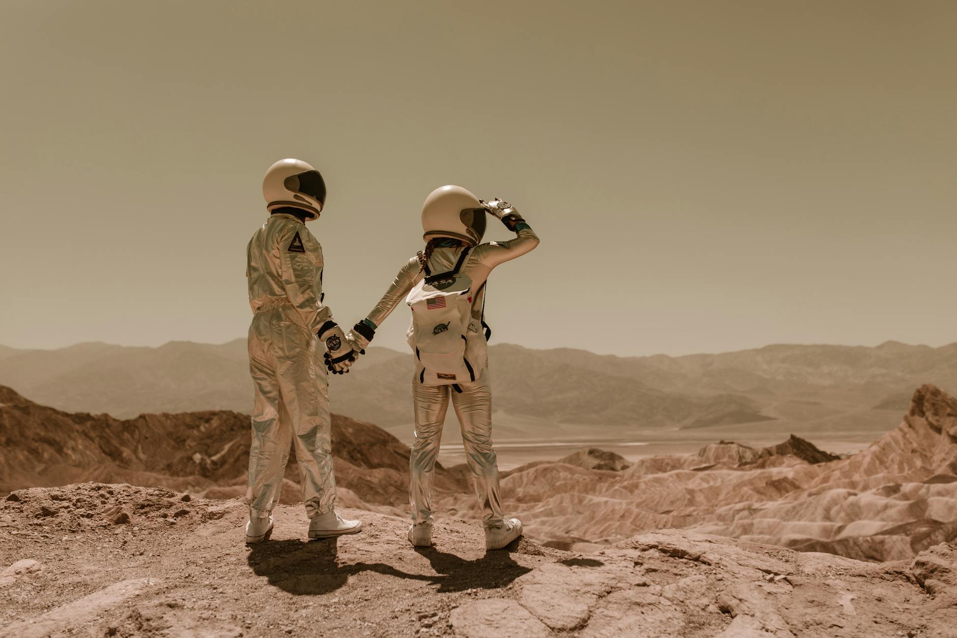 astronauts walking on the sand