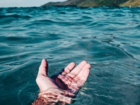 person soaking on body of water